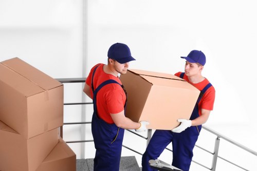 Careful handling of fragile items during a Hackney packing service