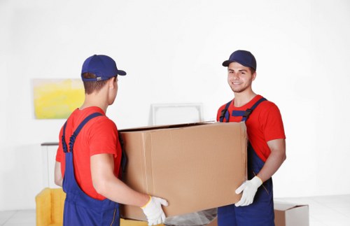 Removal van and moving boxes outside a Hackney residential property