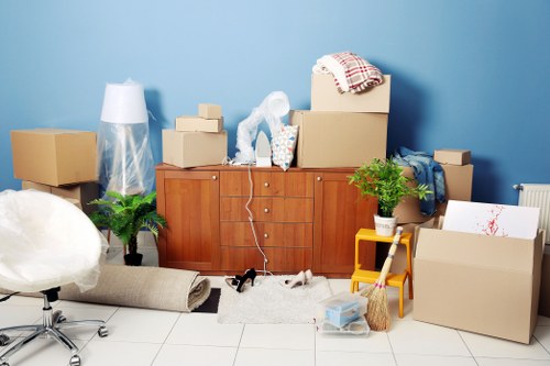 Office relocation crew organising furniture and boxes for a Hackney workplace move