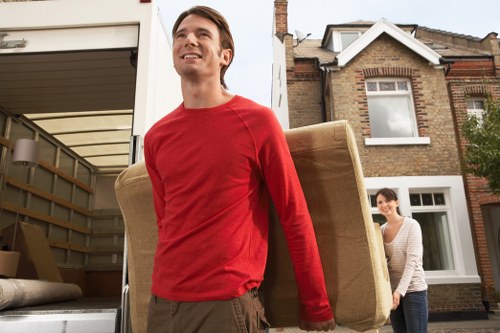 Removal van loading boxes and household items in Hackney