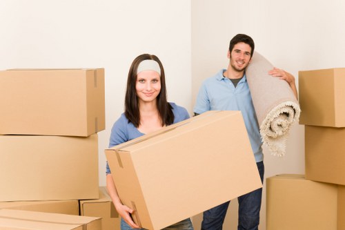 Insured Hackney movers handling furniture carefully