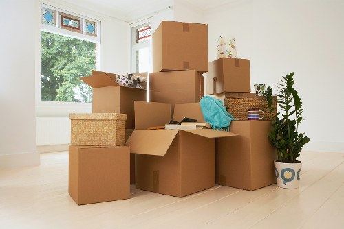 Unpacking boxes in a Hackney flat after relocation