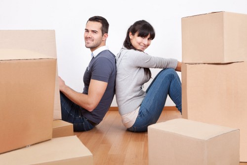Local removals team transporting boxes and furniture in Hackney