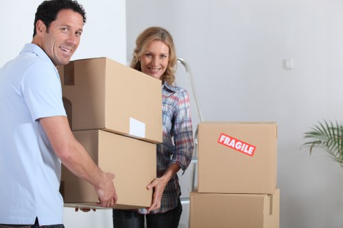 Local movers navigating stairs in a Hackney flat or converted property